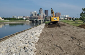 Construction work underway on levee modifications along the riverside in Des Moines, Iowa.
