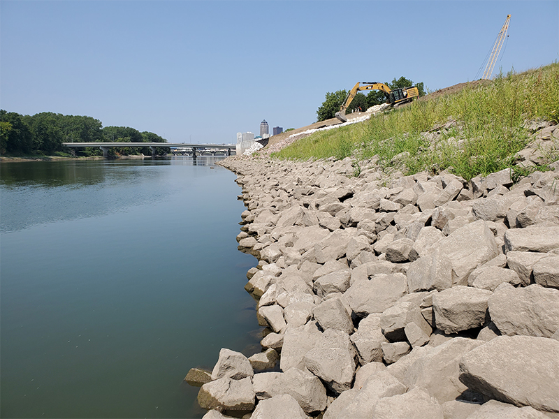 A close-up view of work along the north bank of the Des Moines River, which included slope stabilization and riprap improvements to protect the levee from erosion, as well as a clay blanket to minimize seepage.