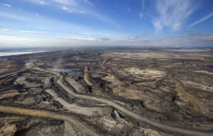 Expansive aerial view of a pit mining project in Alberta's oil sands near Fort McMurray.